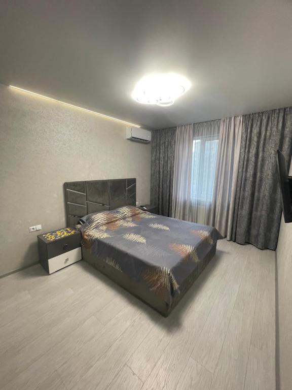Ένα ή περισσότερα κρεβάτια σε δωμάτιο στο VIP new apartment Odessa