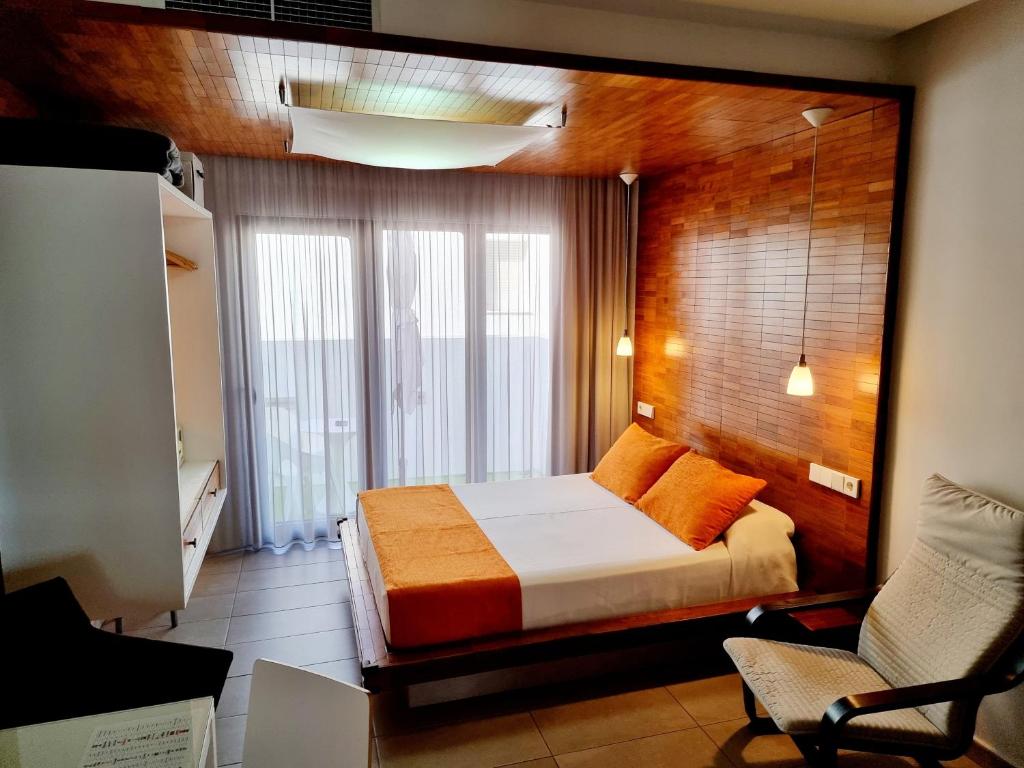 Postel nebo postele na pokoji v ubytování Apartamentos El Arrecife