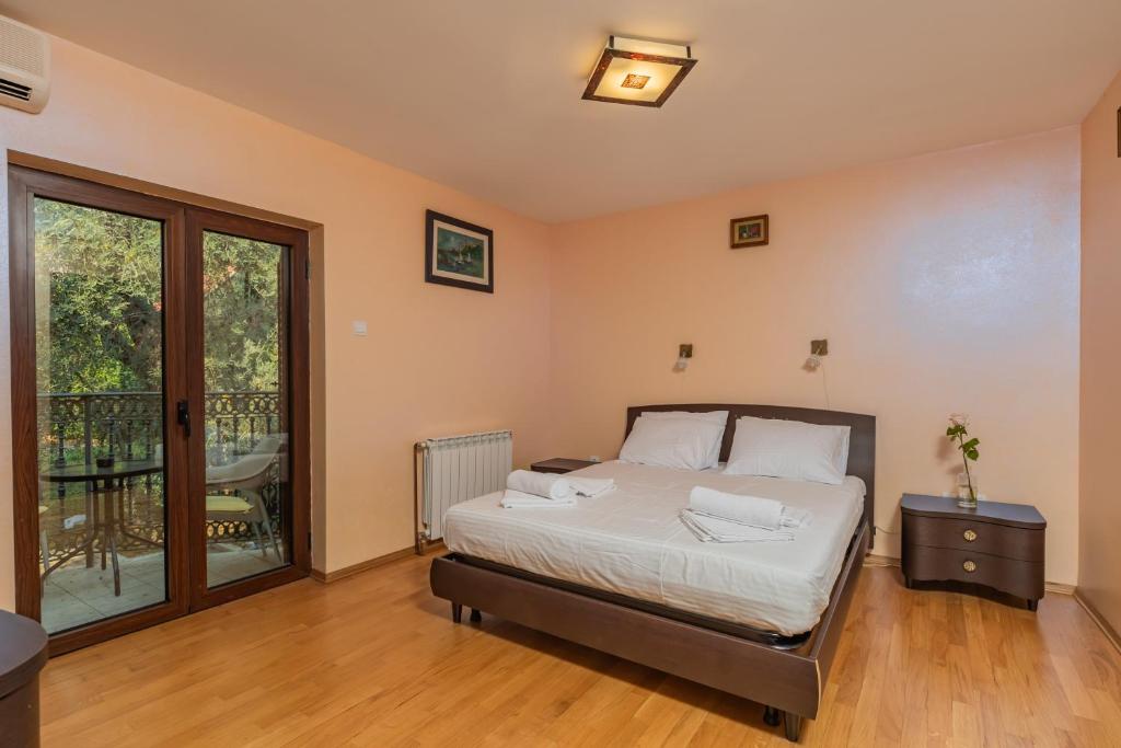 Letto o letti in una camera di Villa Botanicus