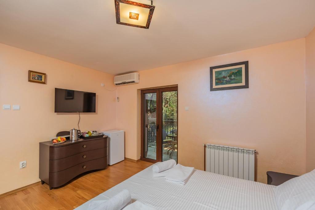Letto o letti in una camera di Villa Botanicus