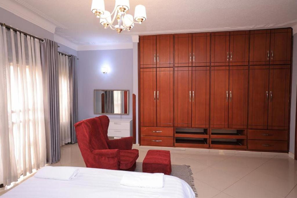 Postel nebo postele na pokoji v ubytování NCI Residence