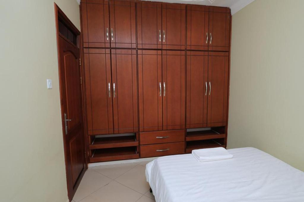 Postel nebo postele na pokoji v ubytování NCI Residence