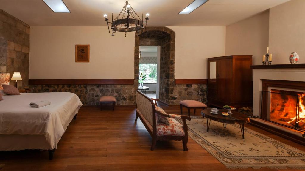 Postel nebo postele na pokoji v ubytování Hacienda La Cienega