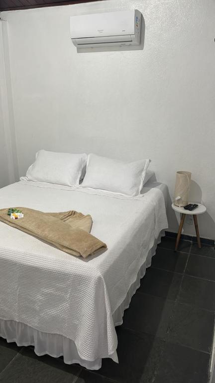 Postel nebo postele na pokoji v ubytování Pousada Recanto da Luísa