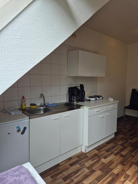 Kuchyň nebo kuchyňský kout v ubytování Hotel am Schenkelberg