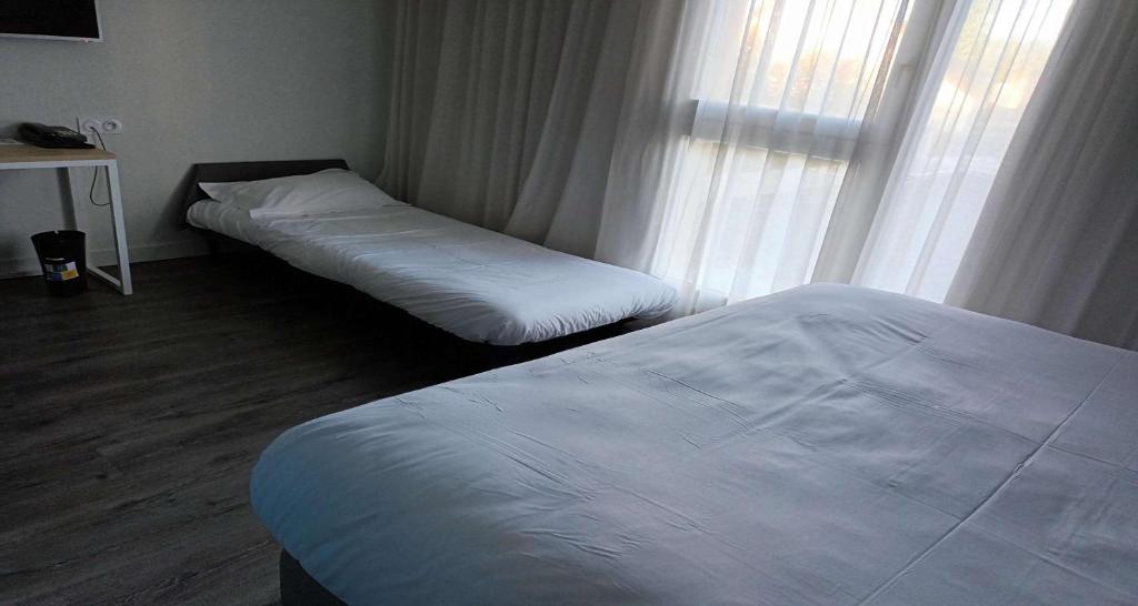 Postel nebo postele na pokoji v ubytování Best Western Armor Park Dinan et Spa
