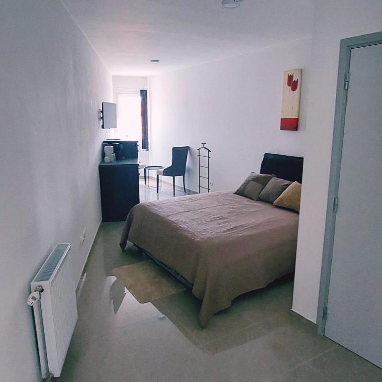 Postel nebo postele na pokoji v ubytování Fenix Apartments