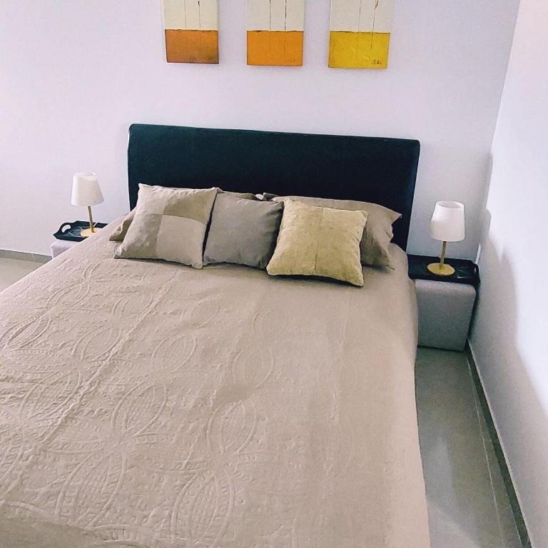 Postel nebo postele na pokoji v ubytování Fenix Apartments