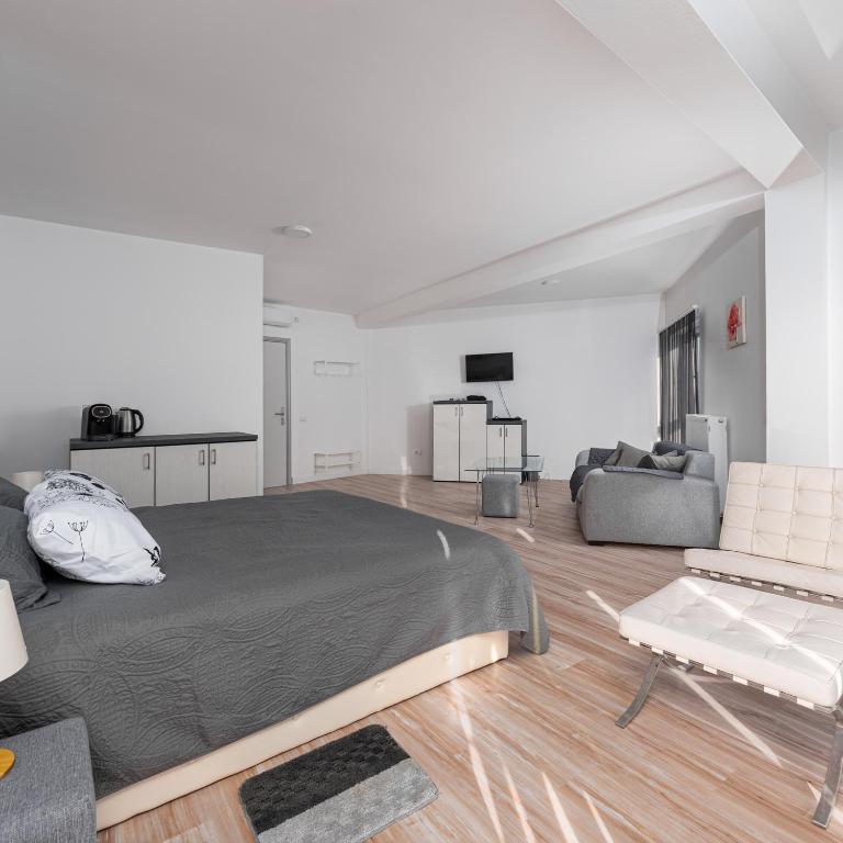 Postel nebo postele na pokoji v ubytování Fenix Apartments