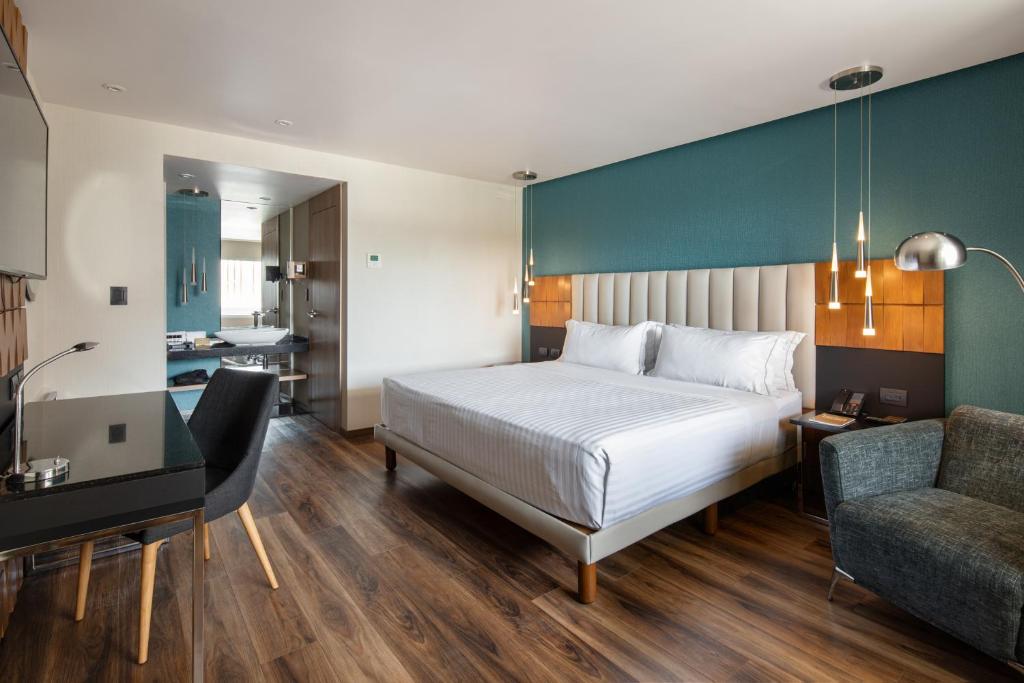 Postel nebo postele na pokoji v ubytování Hotel Real del Rio