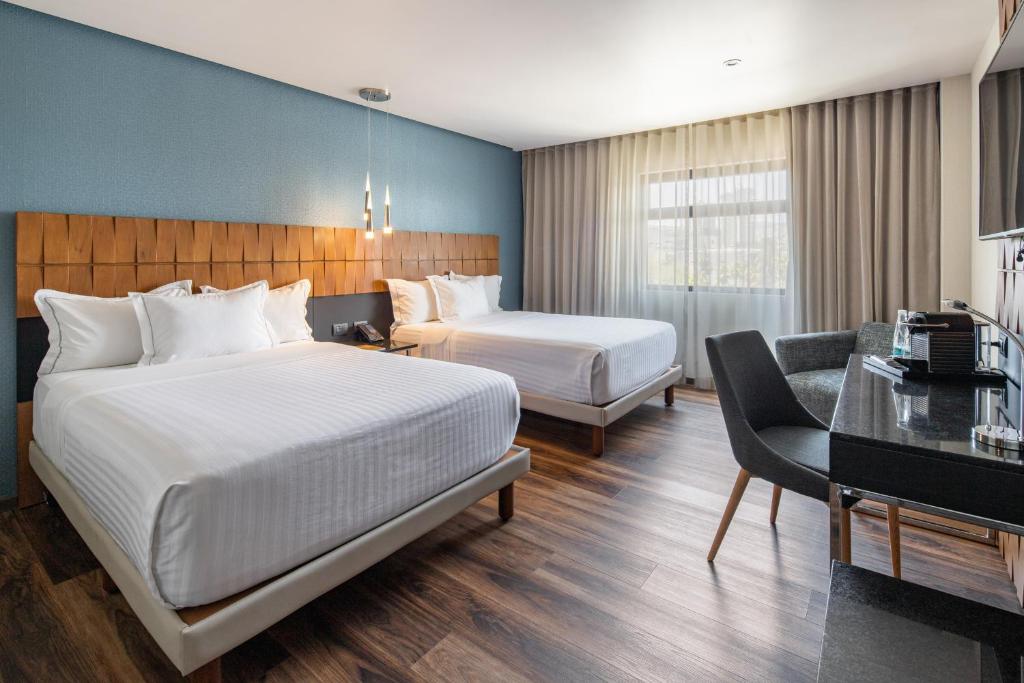Postel nebo postele na pokoji v ubytování Hotel Real del Rio