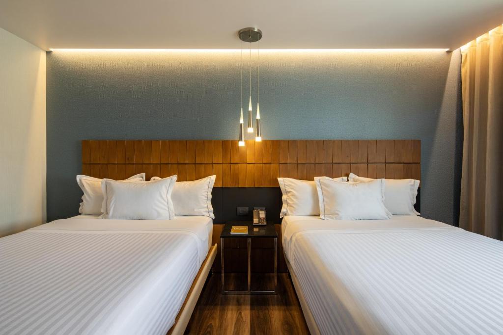 Postel nebo postele na pokoji v ubytování Hotel Real del Rio