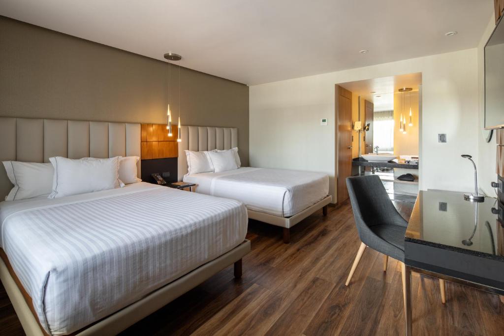 Postel nebo postele na pokoji v ubytování Hotel Real del Rio