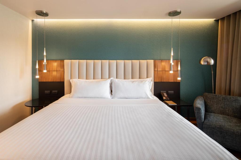 Postel nebo postele na pokoji v ubytování Hotel Real del Rio