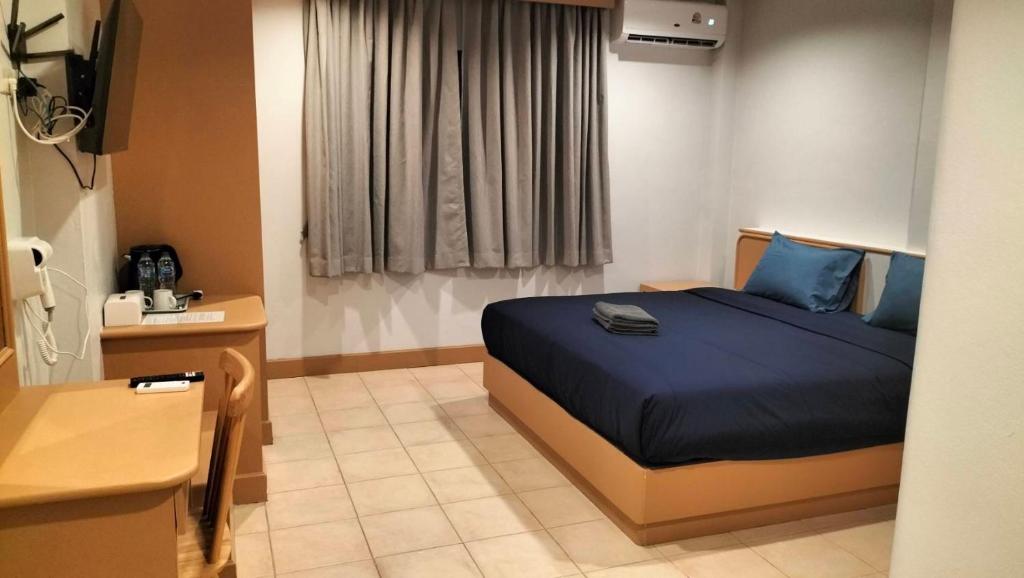 Postel nebo postele na pokoji v ubytování JB House Patong