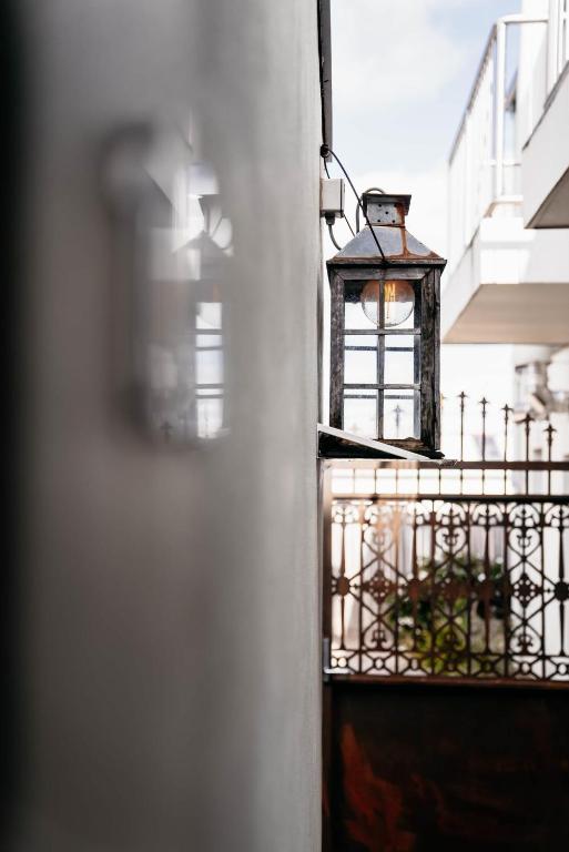 a light on the side of a building at de Russie Boutique Hotel in Orange