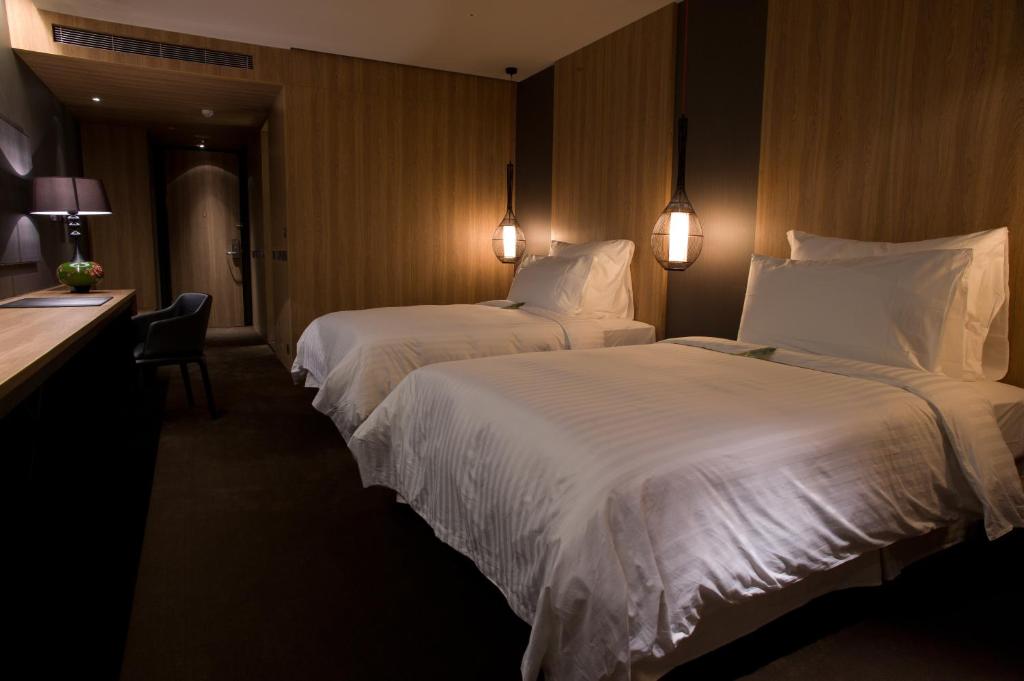 Postel nebo postele na pokoji v ubytování Hotel Dùa