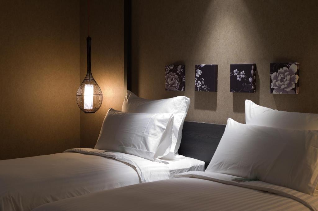 Postel nebo postele na pokoji v ubytování Hotel Dùa