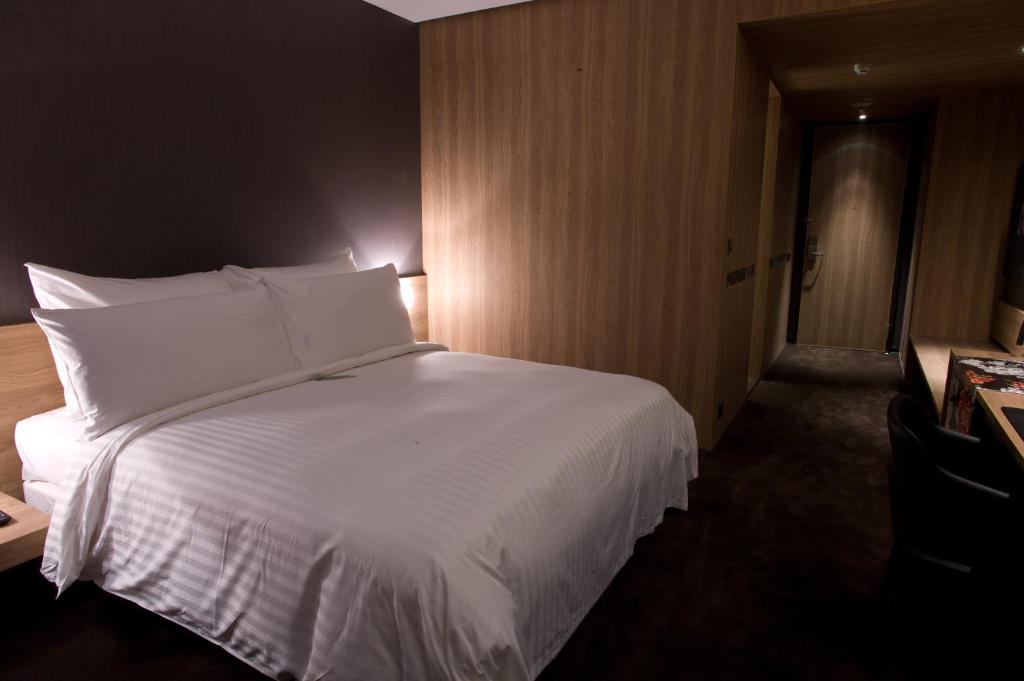 Postel nebo postele na pokoji v ubytování Hotel Dùa