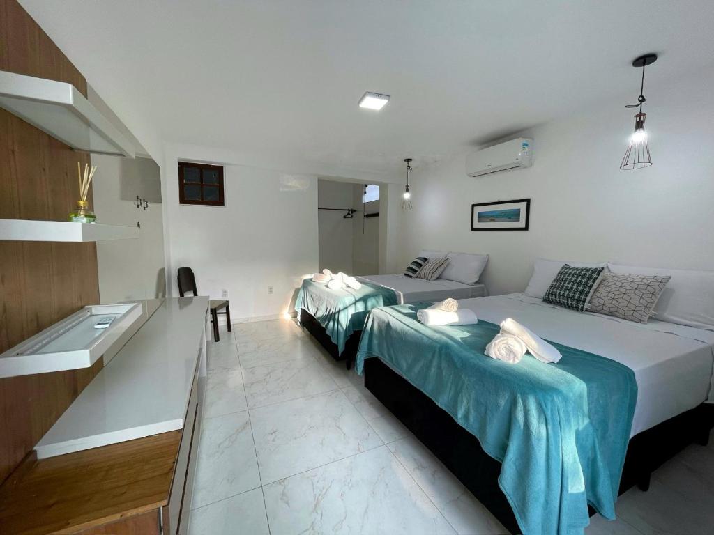 Postel nebo postele na pokoji v ubytování Do Adriano Suites