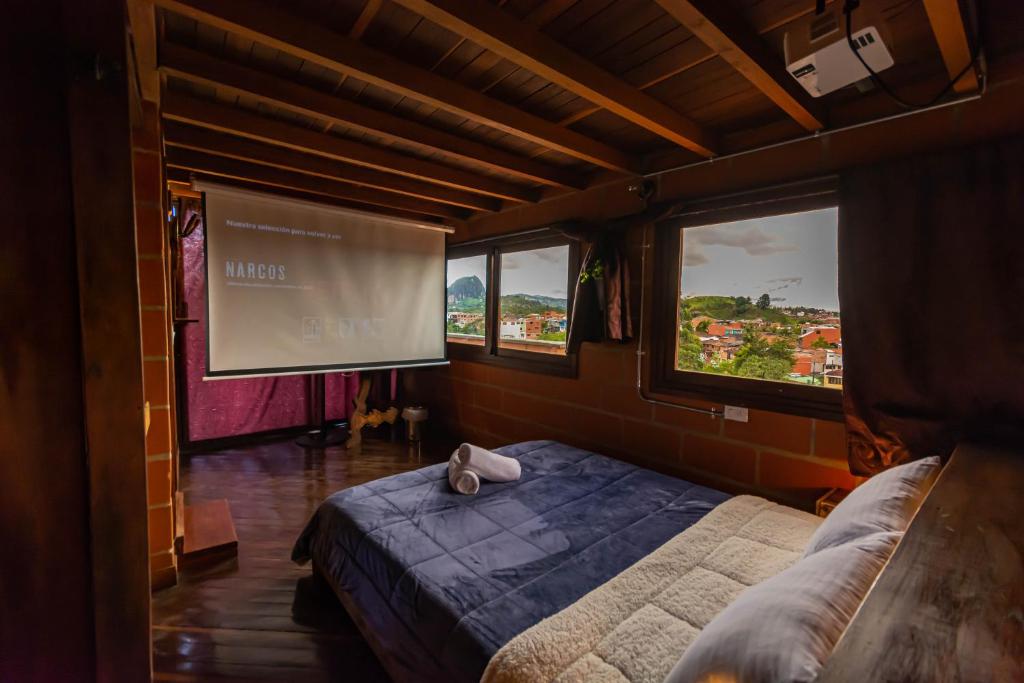 Postel nebo postele na pokoji v ubytování Hotel Spa Bliss Guatape