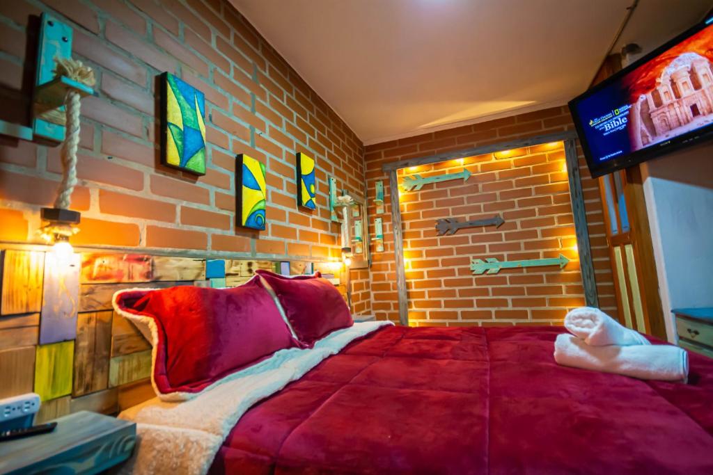Postel nebo postele na pokoji v ubytování Hotel Spa Bliss Guatape