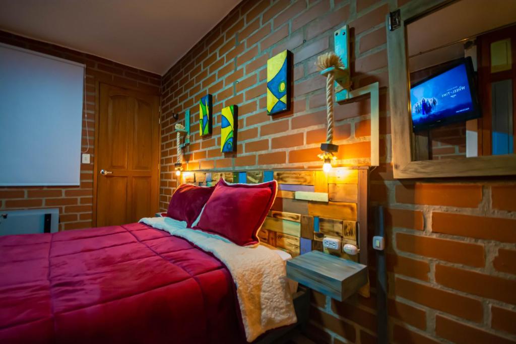 Postel nebo postele na pokoji v ubytování Hotel Spa Bliss Guatape