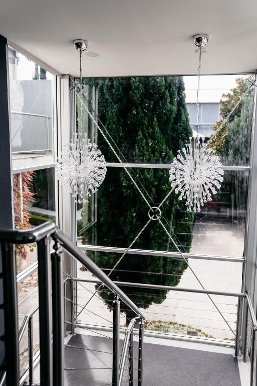 a view of a window with chandeliers at de Russie Boutique Hotel in Orange