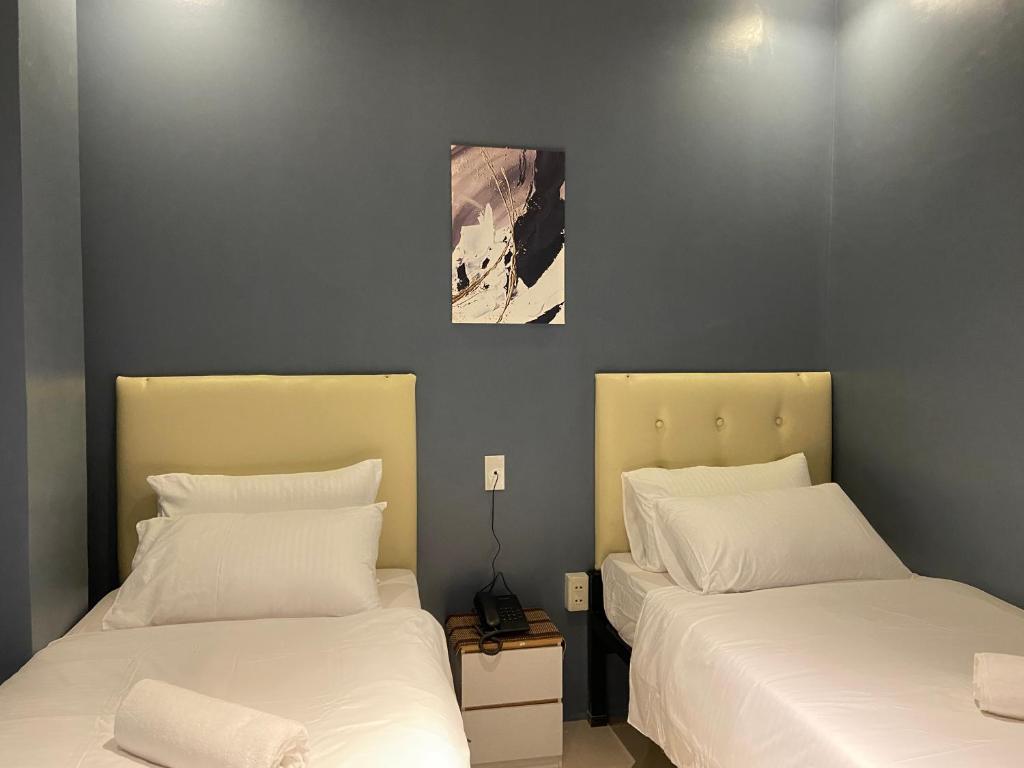 Postel nebo postele na pokoji v ubytování IAO Boutique Hotel