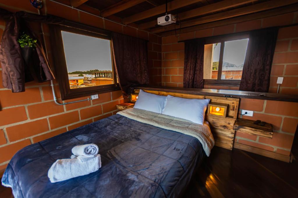 Postel nebo postele na pokoji v ubytování Hotel Spa Bliss Guatape