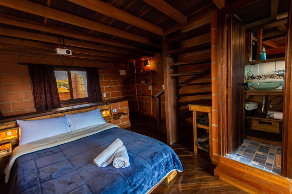 Postel nebo postele na pokoji v ubytování Hotel Spa Bliss Guatape