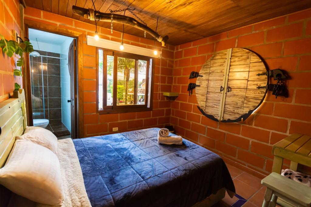 Postel nebo postele na pokoji v ubytování Hotel Spa Bliss Guatape