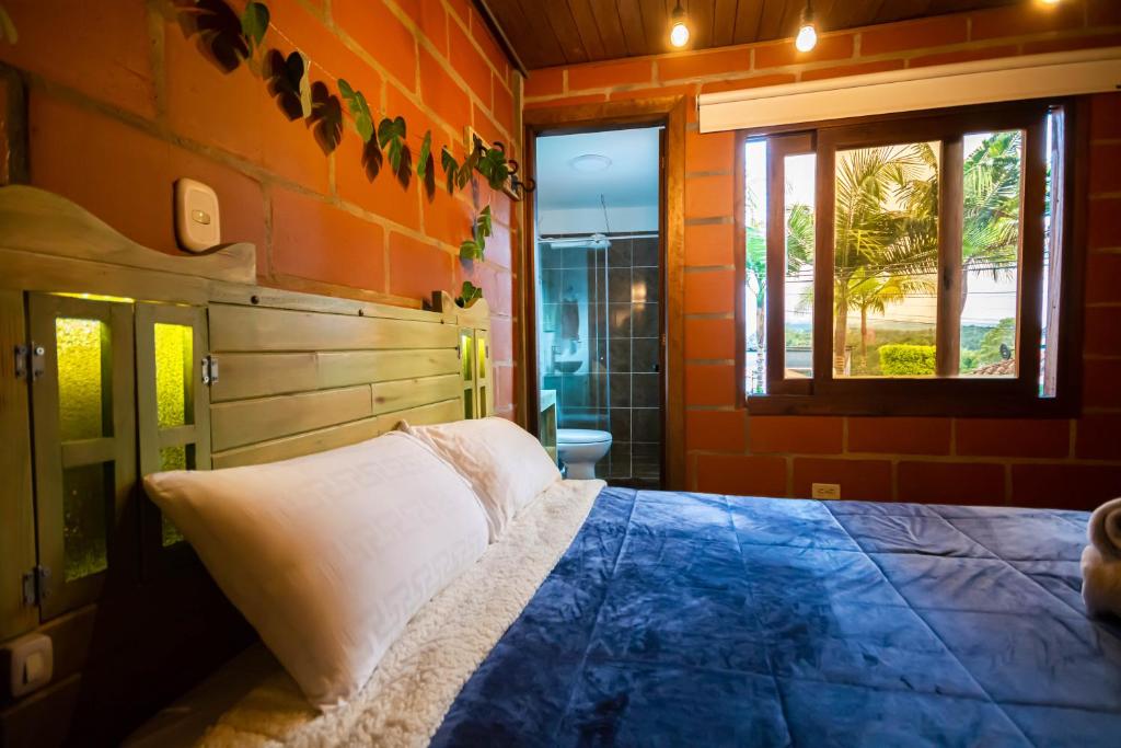 Postel nebo postele na pokoji v ubytování Hotel Spa Bliss Guatape