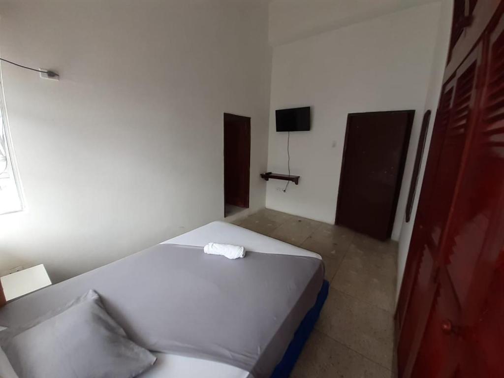Postel nebo postele na pokoji v ubytování Hostal Tamara
