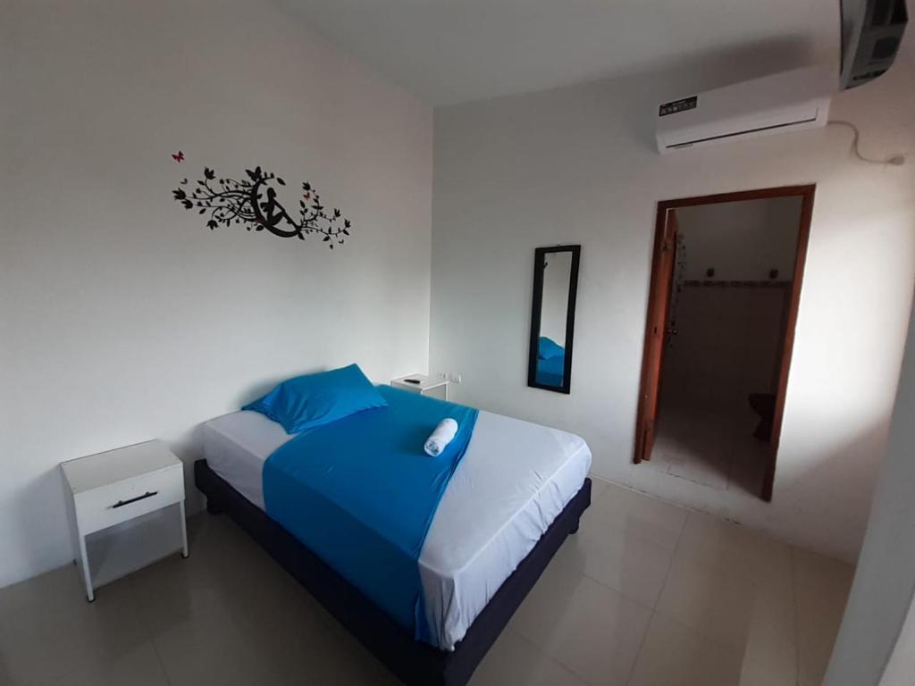 Postel nebo postele na pokoji v ubytování Hostal Tamara