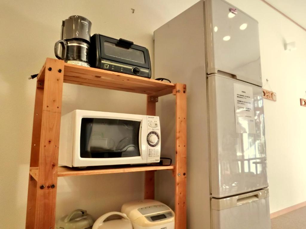 Kuchyň nebo kuchyňský kout v ubytování Kencha Rumah