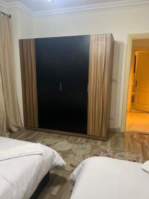 Postel nebo postele na pokoji v ubytování furnished Hotel apartment with Private Garden B8