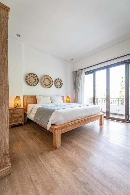 Postel nebo postele na pokoji v ubytování Gajahmina Guesthouse