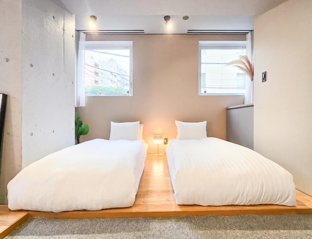 Postel nebo postele na pokoji v ubytování STAY ARI Apartment Hotel Shinjuku-Takadanobaba