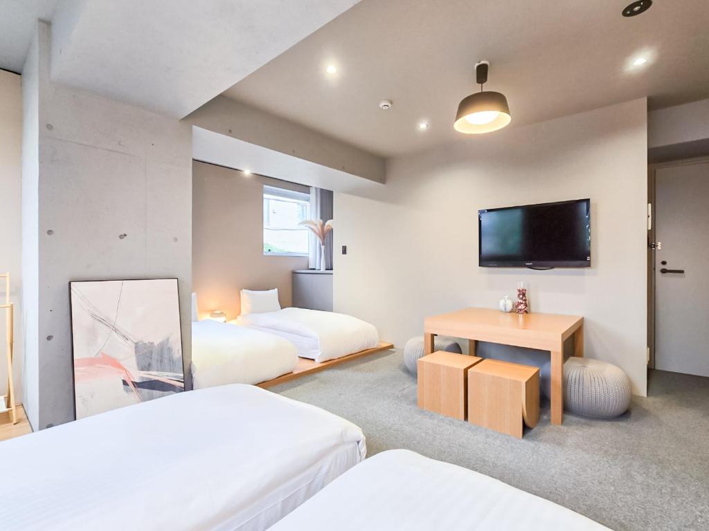 Postel nebo postele na pokoji v ubytování STAY ARI Apartment Hotel Shinjuku-Takadanobaba