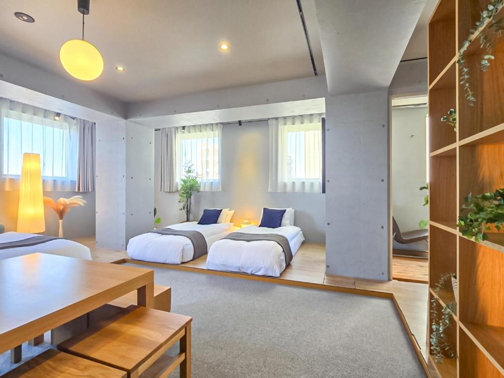 Postel nebo postele na pokoji v ubytování STAY ARI Apartment Hotel Shinjuku-Takadanobaba