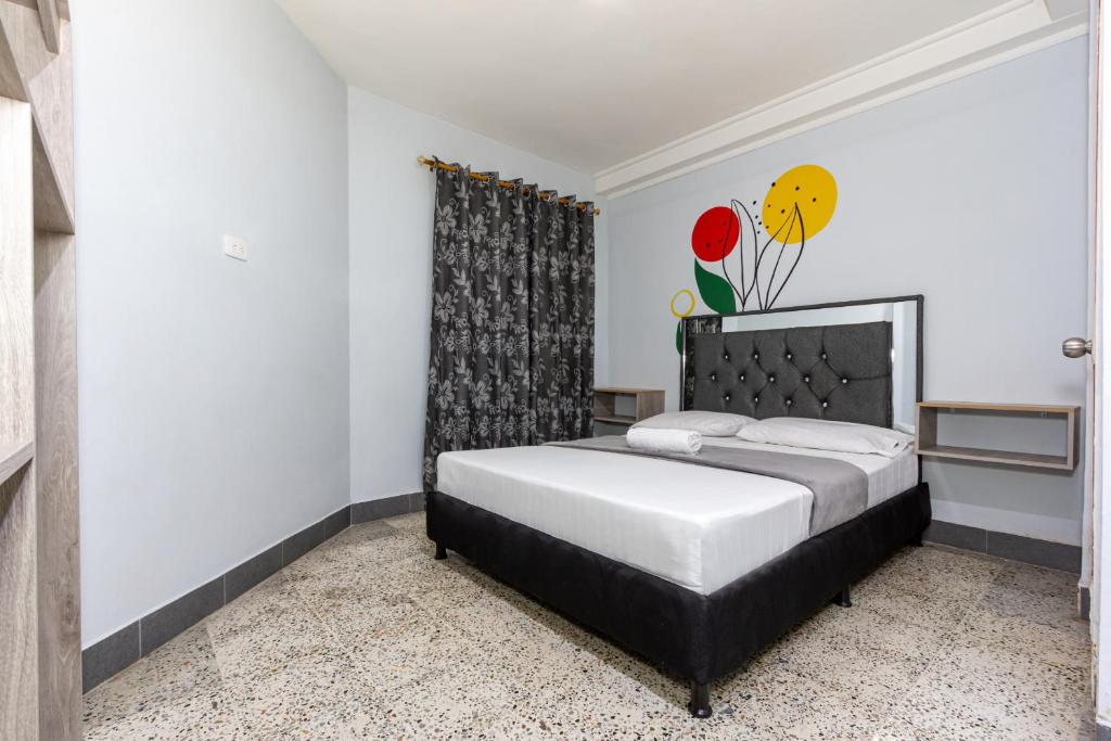 Postel nebo postele na pokoji v ubytování Hotel Guayacanes 70