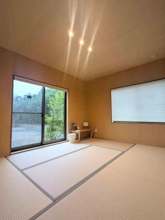 Postel nebo postele na pokoji v ubytování SEN.RETREAT TAKAHARA