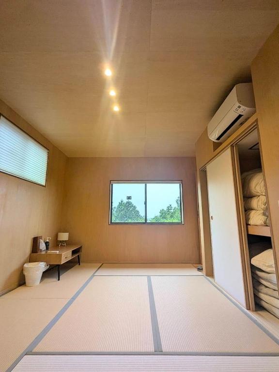 Postel nebo postele na pokoji v ubytování SEN.RETREAT TAKAHARA