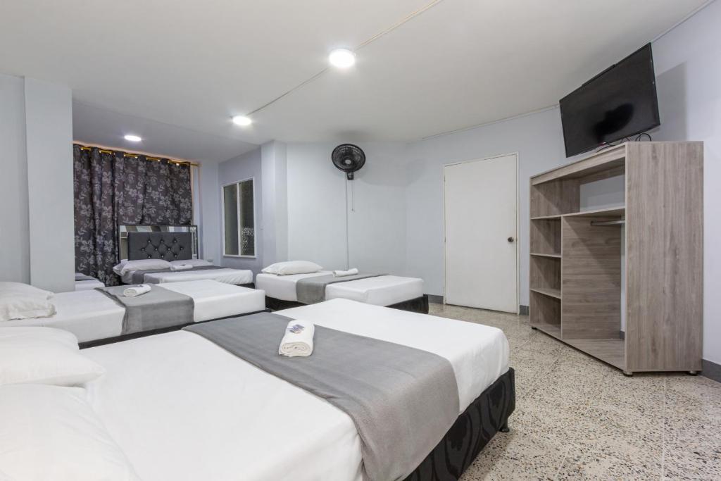 Postel nebo postele na pokoji v ubytování Hotel Guayacanes 70