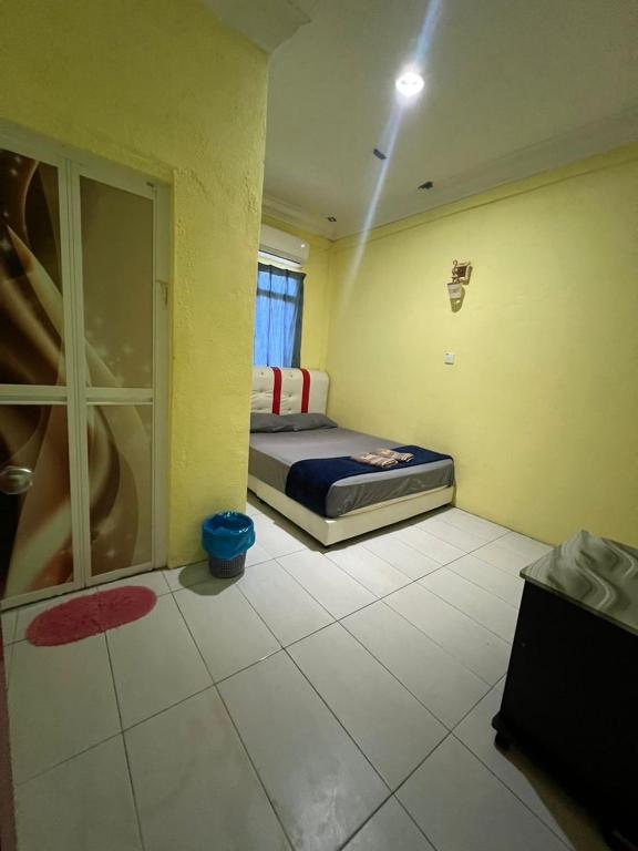 Postel nebo postele na pokoji v ubytování Perhentian Kiara