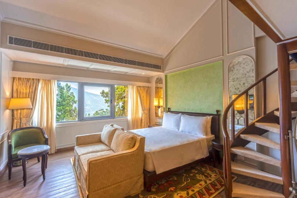a hotel room with a bed and a staircase at Namah Nainital, a member of Radisson Individuals Retreats in Nainital