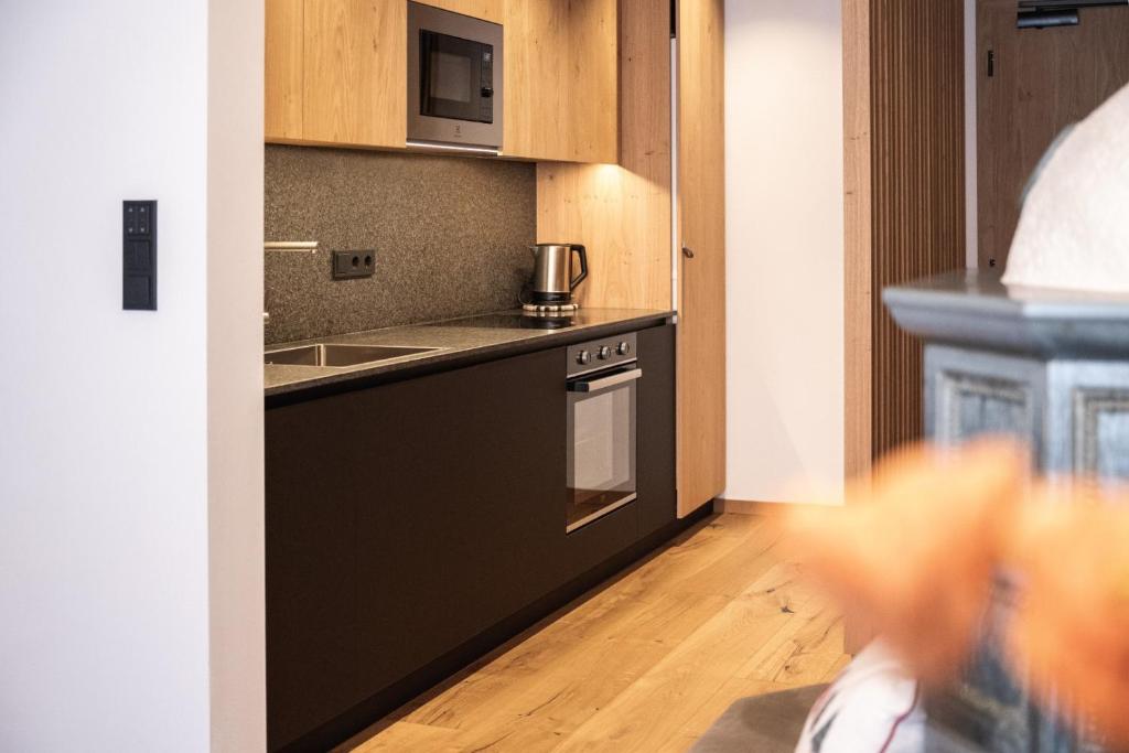 Kuchyň nebo kuchyňský kout v ubytování Aparthotel Zum Schlössl