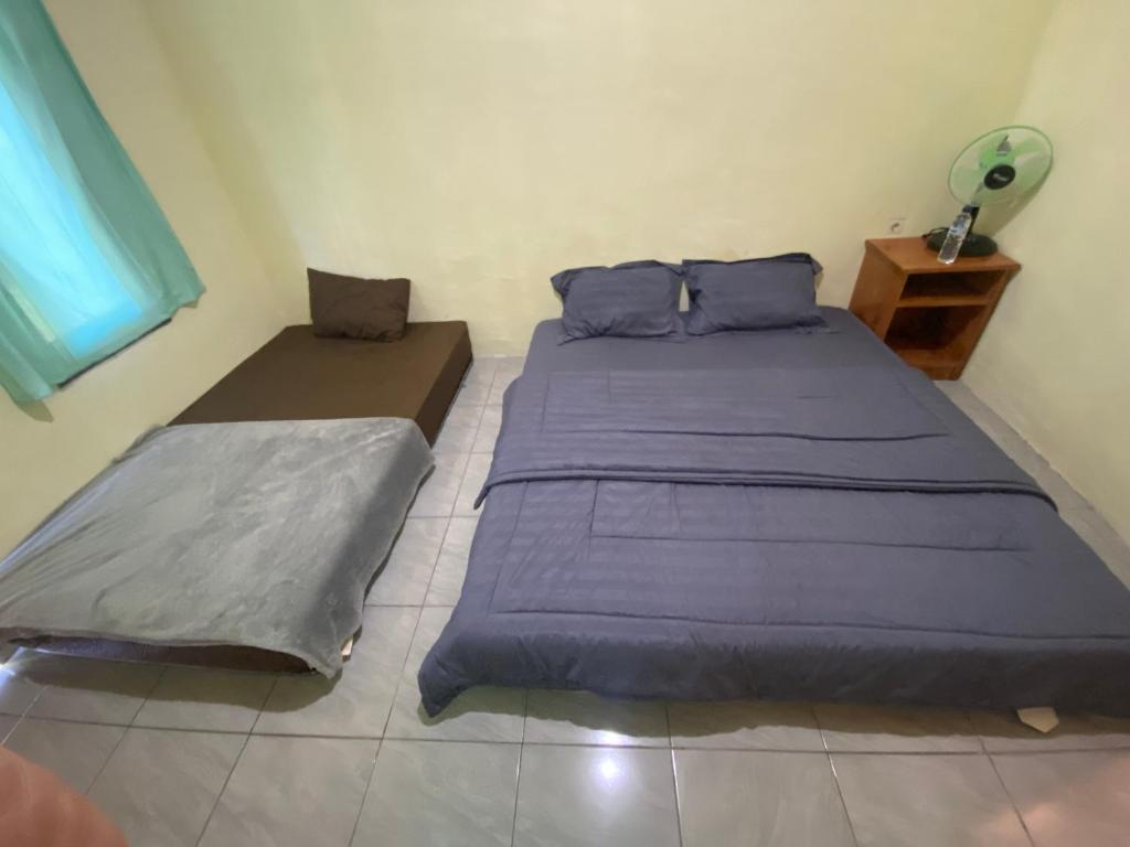 Voodi või voodid majutusasutuse Pondok rinjani bungalow tetebatu toas