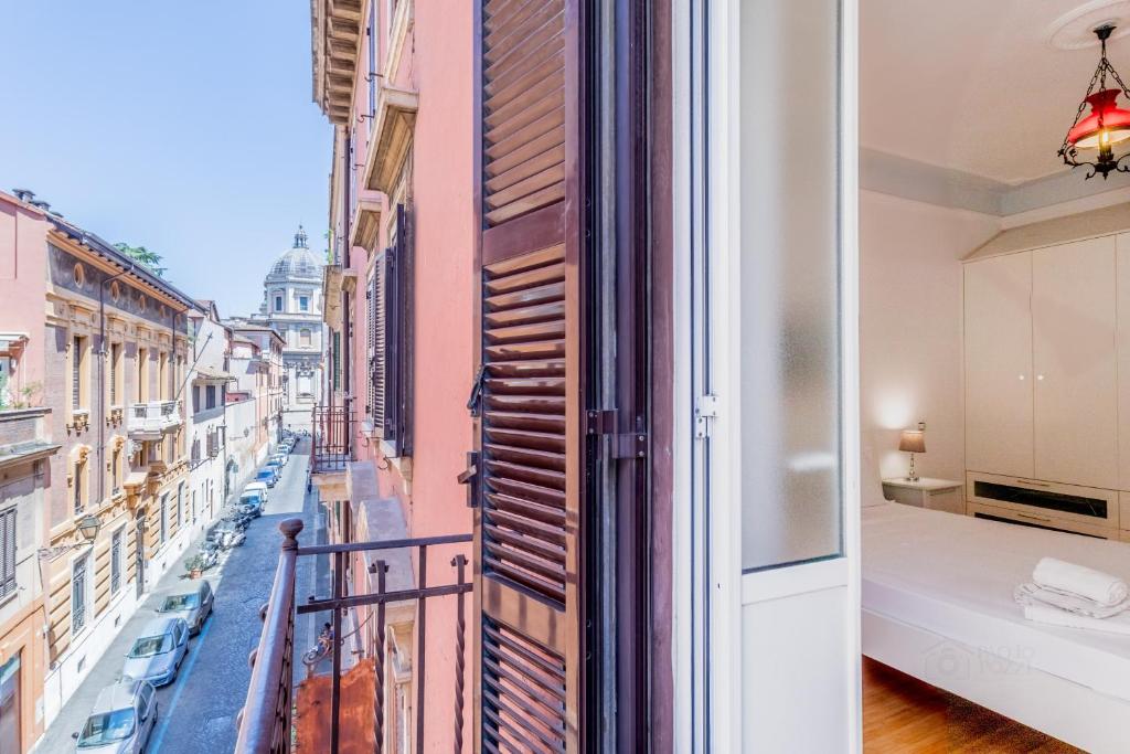 Posteľ alebo postele v izbe v ubytovaní BBHOME Comfort apartment near Colosseum